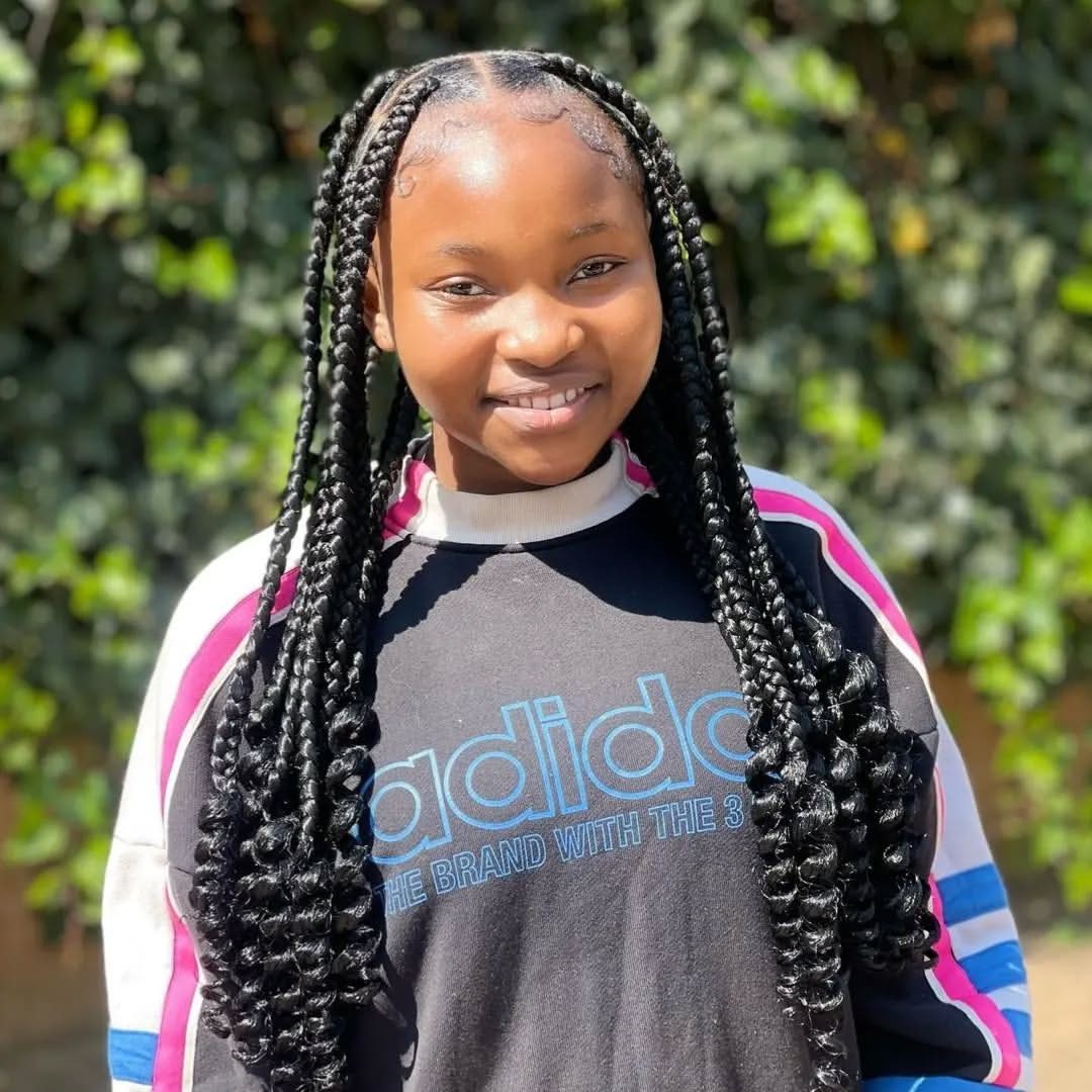 Long braids smiling portrait