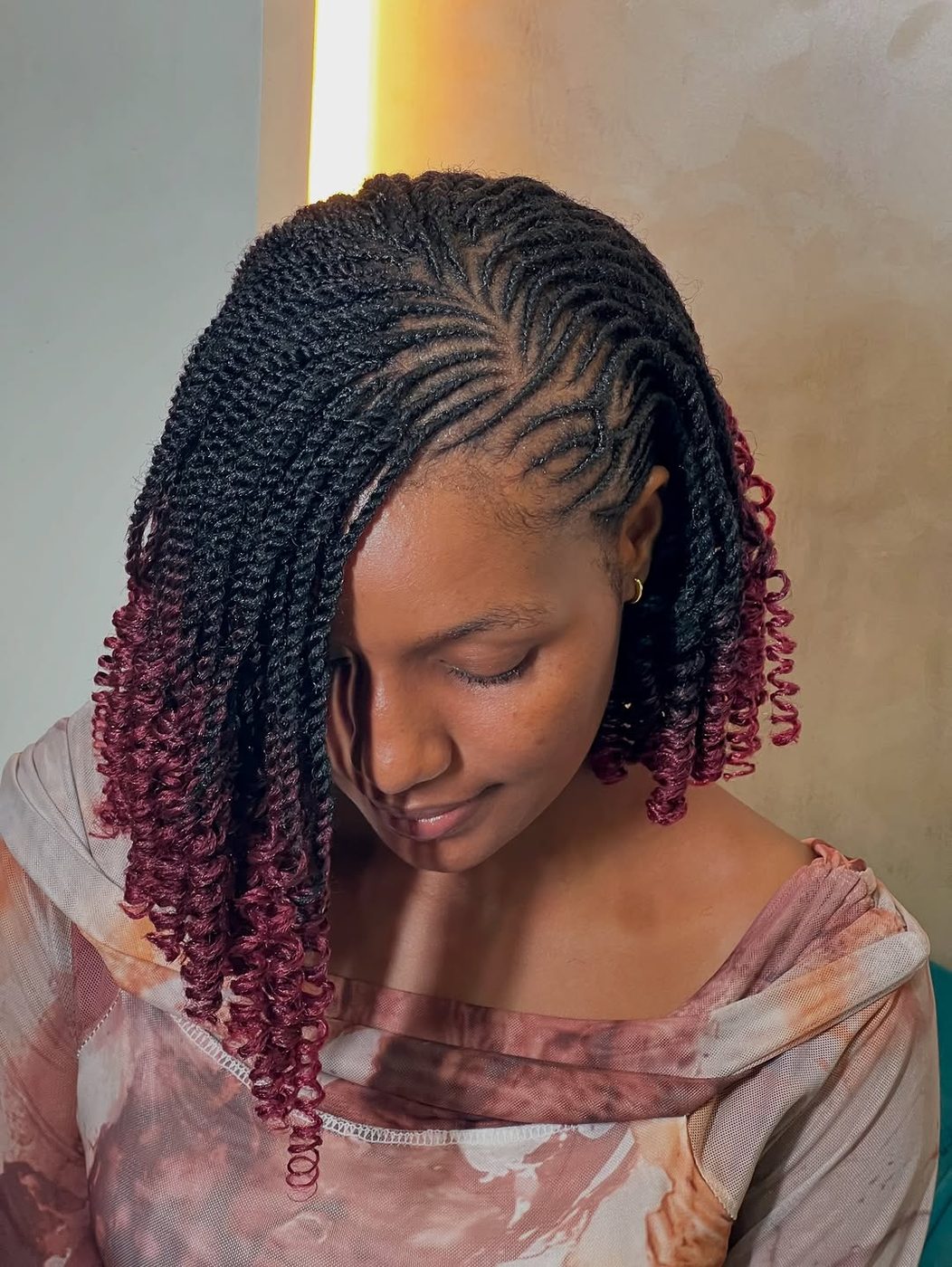 Burgundy curly bob portrait
