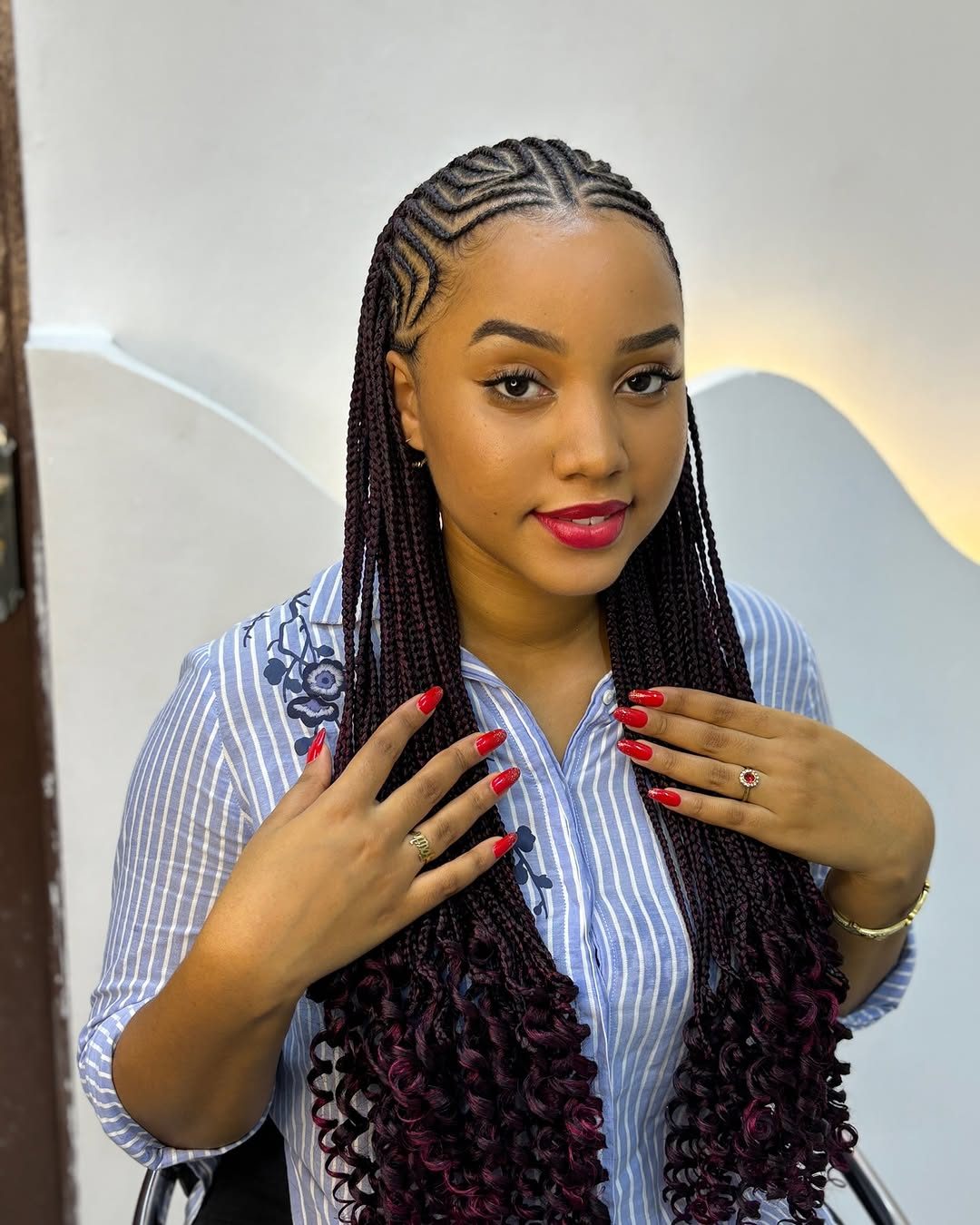Cornrows with long burgundy braids