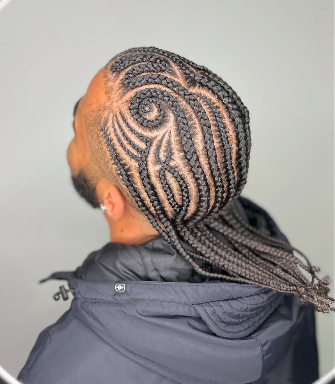 Intricate cornrow pattern braids