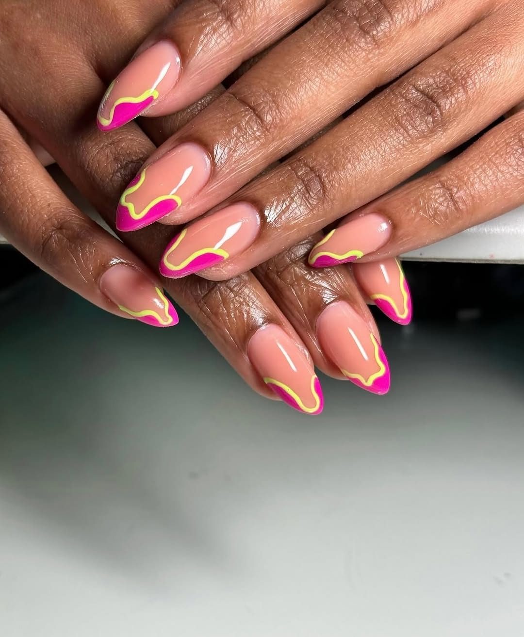 Pink and white french tip nails closeup