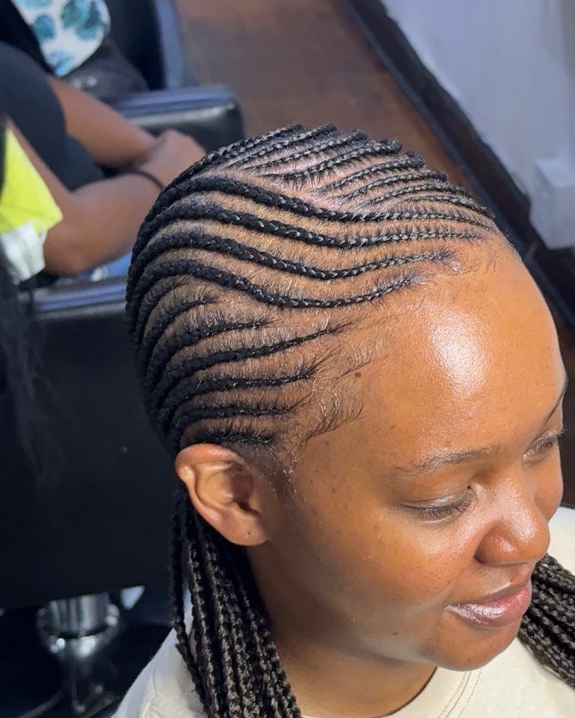 Cornrow braids low bun side profile
