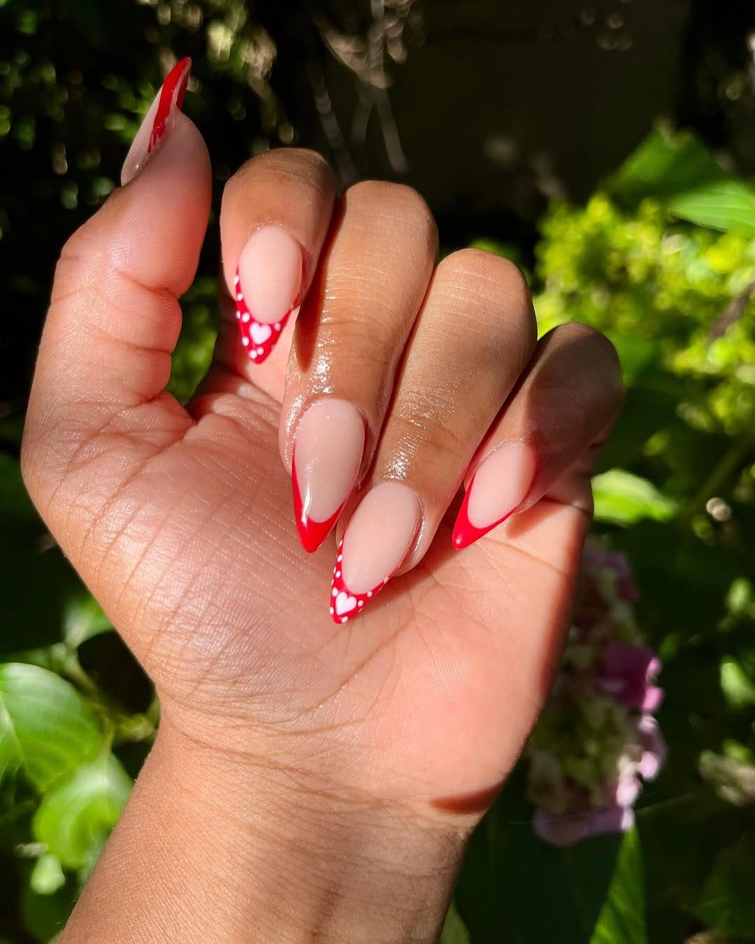 Red french tip nails closeup